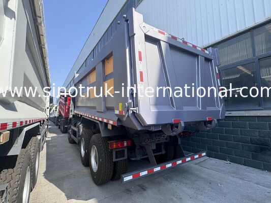 SINOTRUK HOWO TX Modelo 371HP LHD camión de descarga con tirador 6X4 Con luces de advertencia tipo U Color gris